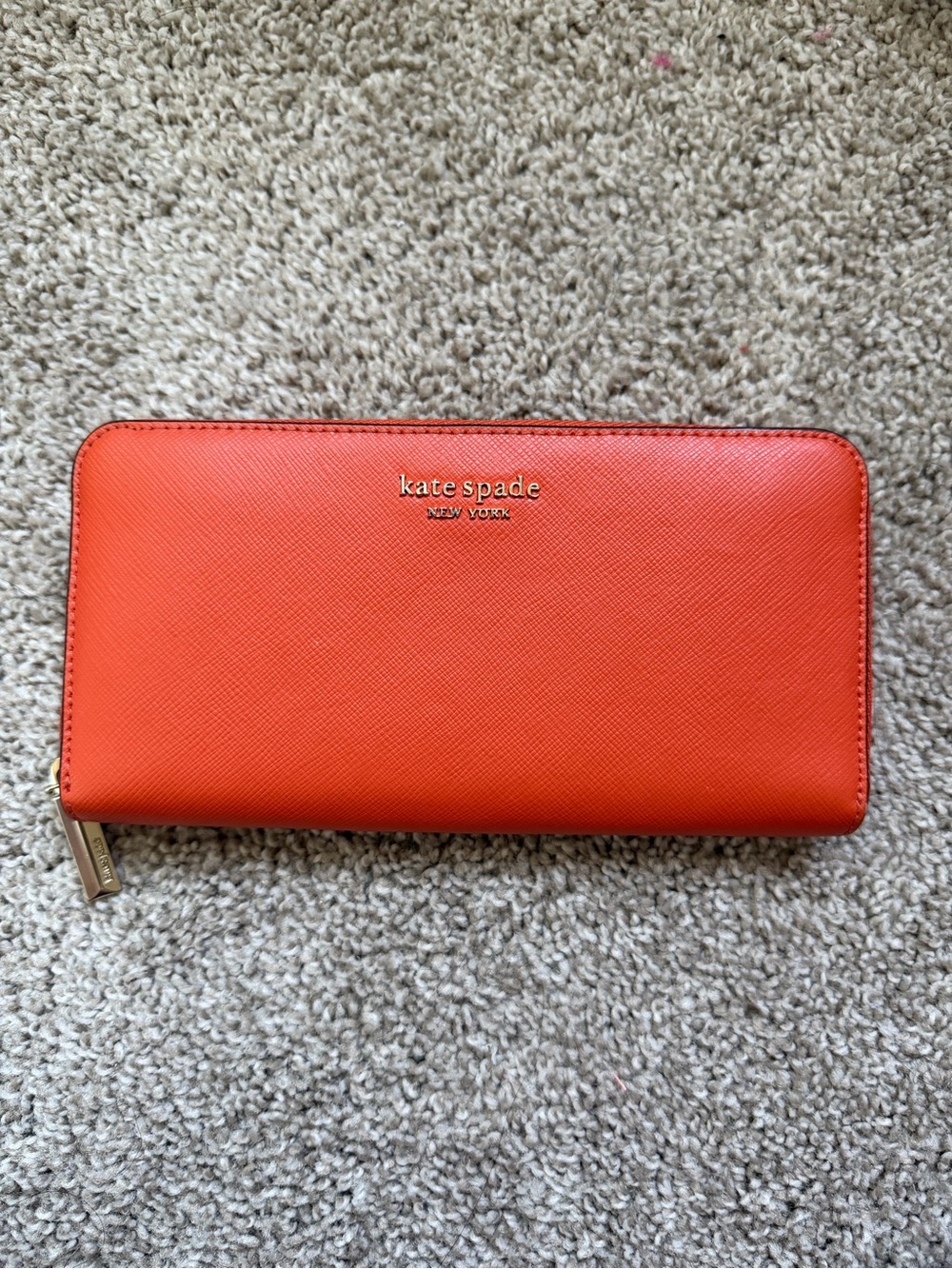 Kate Spade coral saffiano leather zip wristlet with gold hardware